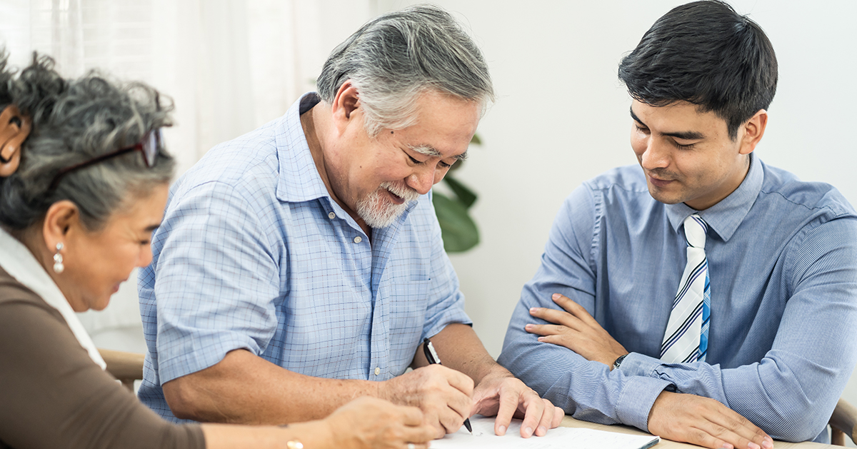 Asian couple senior elder making health insurance contract on ta